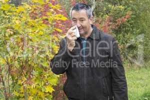 man with handkerchief in autumn