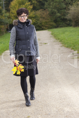 woman alone in the autumn walk