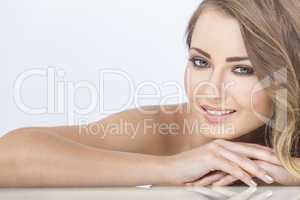 smiling beautiful woman resting on hands