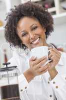 mixed race african american girl drinking coffee