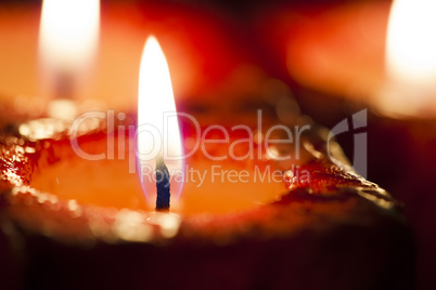 Red candles out of focus