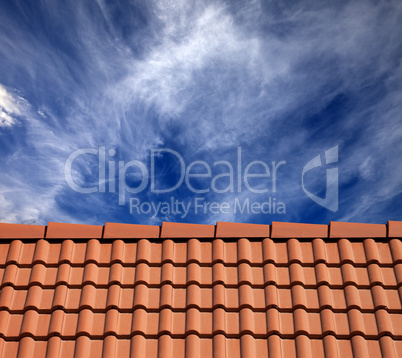 roof tiles and sky with clouds at sun day