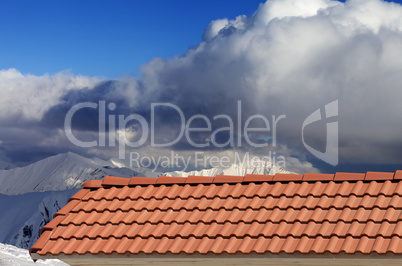 roof tiles and snowy mountains