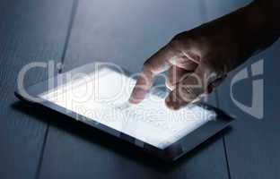 hand presses on screen digital tablet