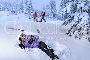 injured skier after accident waiting for rescue