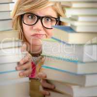 desperate student teenager look from behind books