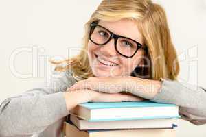 happy girl student with stack of books