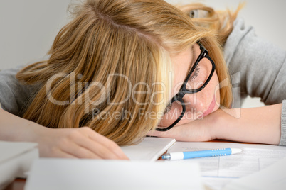 sleeping student teenager lying on table