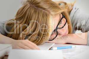 sleeping student teenager lying on table