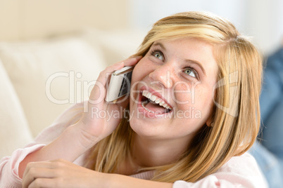 cheerful teenage woman laughing calling on phone