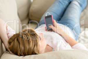 teenage woman relax on sofa listen music
