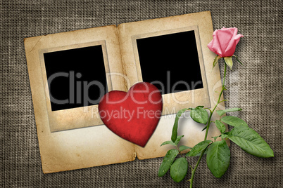 two old-style photo  with red paper heart with pink rose