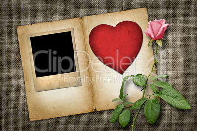 old-style photo  with red paper heart with pink rose