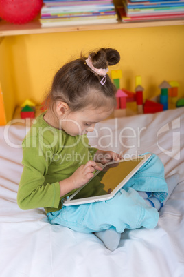 small girls with tablet