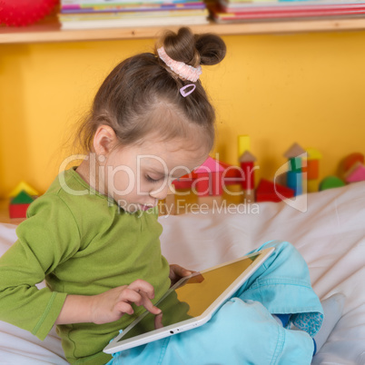 small girls with tablet