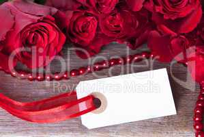 white label with red roses