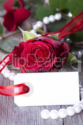 white label with red rose