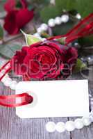 white label with red rose