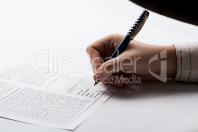 man signing a contract