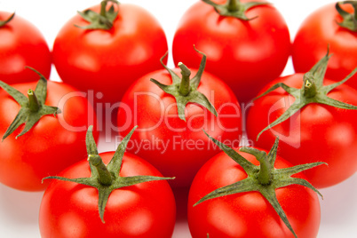 some red tomatoes close-up on a white background