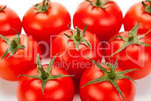 some red tomatoes close-up on a white background