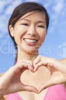 chinese asian woman girl making heart hands shape