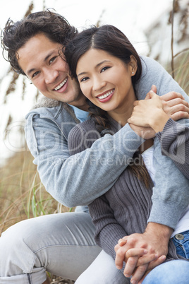 asian man woman romantic couple on beach dunes