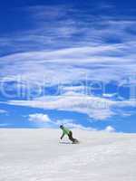 snowboarder on ski slope and blue sky