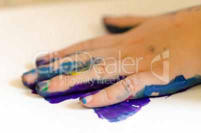 child painting with hands