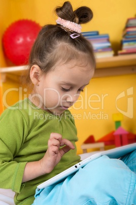 small girls with tablet