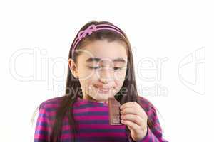 young girl eating chocolate