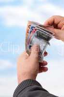 hands holding banknotes