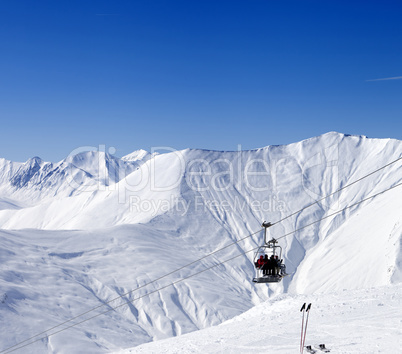 skiers on ropeway at ski resort gudauri