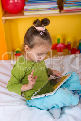 small girls with tablet