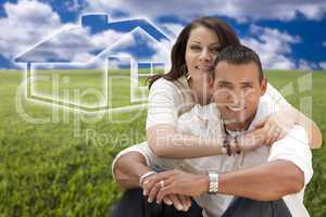 hispanic couple sitting in grass field with ghosted house behind