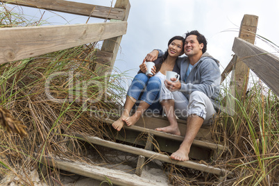 asian man woman romantic couple on beach steps