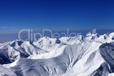 view on off-piste slopes and multicolor blue sky at nice sunny d