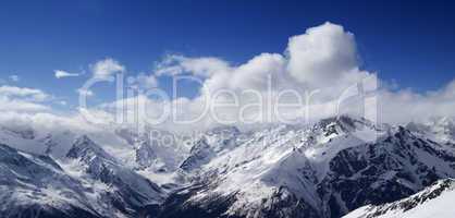 panorama of caucasus mountains in sunny clouds
