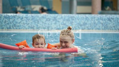 Mother and son in the swimming pool