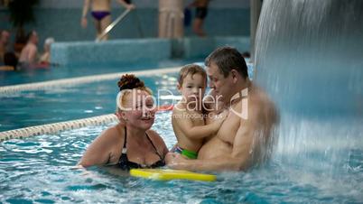 Grandparents and a grandson in the swimming pool