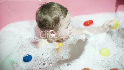 boy playing in the bath