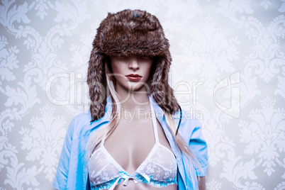 mannequin in a fur winter hat and lingerie