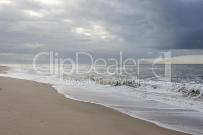 beach with dark rain clouds