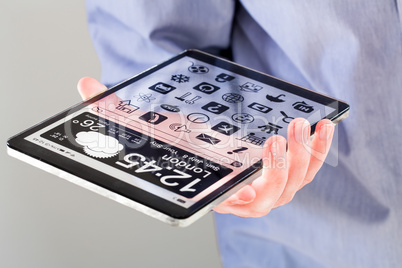 tablet with transparent screen in human hands.