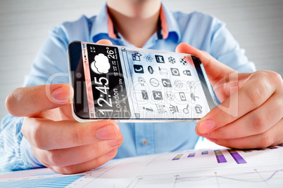 smartphone with transparent screen in human hands.
