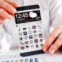 smartphone with transparent screen in human hands.