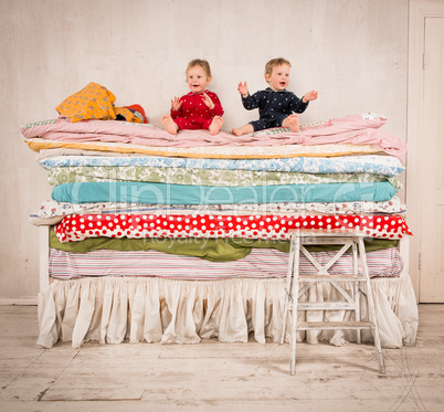 children on the bed - princess and the pea.
