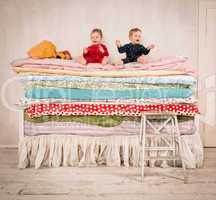 children on the bed - princess and the pea.