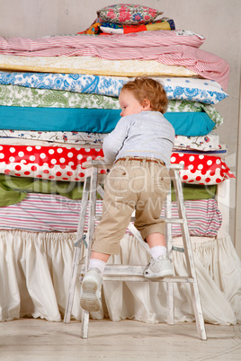 child climbs on the bed - princess and the pea.