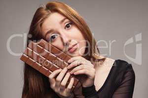 portrait of sad young girl with the big chocolate